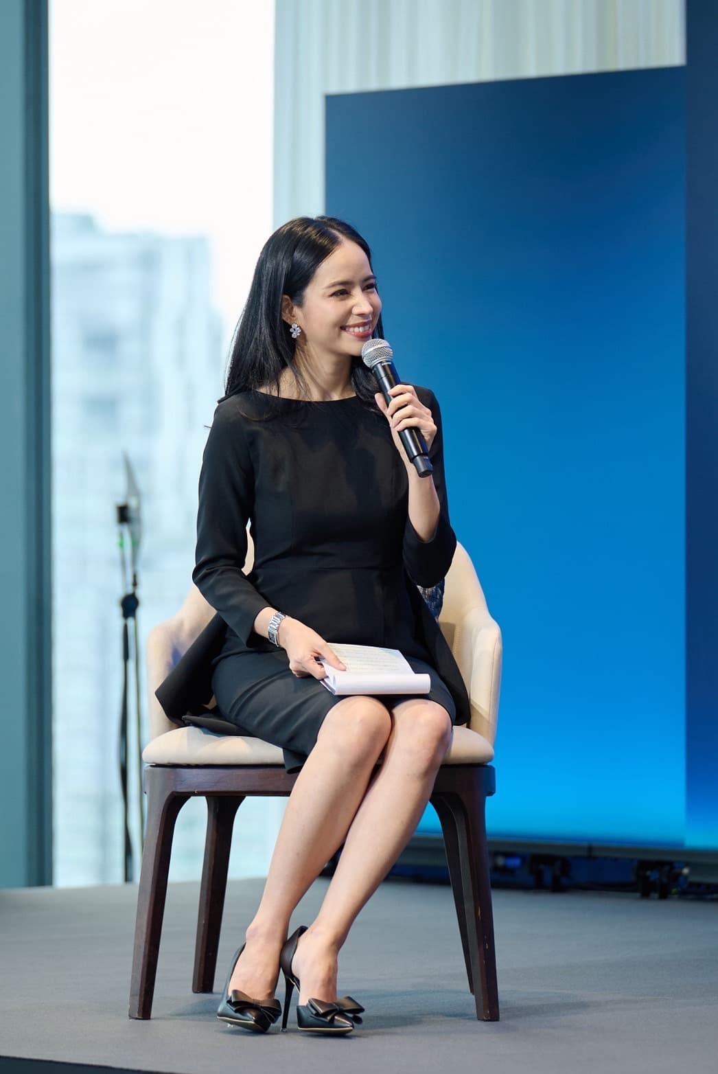 Chats Kannat on stage — Bilingual Emcee in action